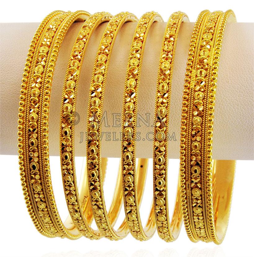 Indian Golden Bangles. Bracelet With Diamonds And Stones On A Red Satin  Background, Indian Traditional Jewellery,Style, Fashion And Design Of  Jewelry Stock Photo, Picture and Royalty Free Image. Image 156084303.